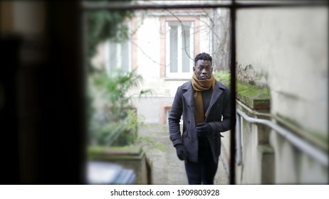 Young Black Man Walking Through Corridor Leaving House, Person Getting Out