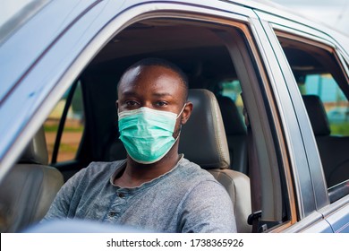 Young Black Man Wearing A Nose Mask And Driving His Car