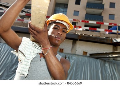 Young Black Man Working In Construction Site