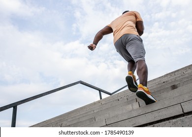 Young Black Man Workout At The City Street.He Runs Up The Stairs.Pushing To The Limit.