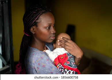 Young Black Mother Holding Baby