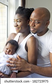 Young black nigerian family with a newborn baby