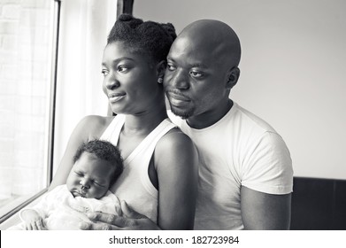 Young Black Nigerian Family With A Newborn Baby