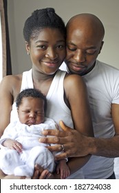 Young black nigerian family with a newborn baby