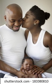 Young Black Nigerian Family With A Newborn Baby