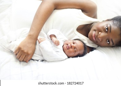 Young black nigerian mother with her newborn baby