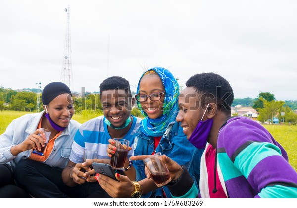 Young Black People Sitting Park Drinking Stock Photo 1759683269 ...