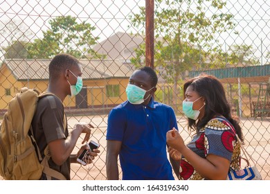 Young Black People Wearing Face Masks Having A Conversation