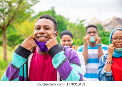 Young Black People Wearing Face Masks, With Physical Distancing, Smiling