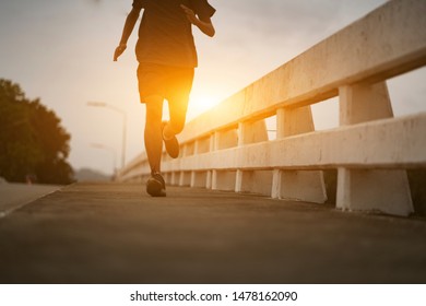  Young black runner man running on the street be exercise and workout in nature countryside road in the morning. Healthy body exercise sports concept. - Shutterstock ID 1478162090