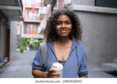 Young Black student woman is living in city. Lifestyle and education. - Powered by Shutterstock