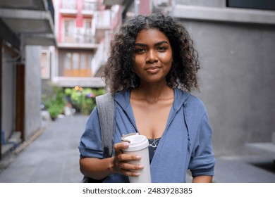 Young Black student woman is living in city. Lifestyle and education. - Powered by Shutterstock