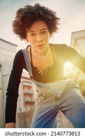 Young Black Stylish Curly Afro Hair Woman Posing Outdoor Dancing Cool Attitude And Confidence