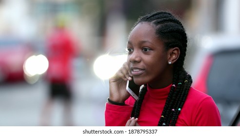 Young Black Teen Girl Talking On Phone, Candid African Teenager Discussing On Cellphone