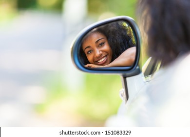 Young Black Teenage Driver Seated In Her New Convertible Car - African People