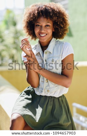 Similar – blYoung black woman, afro hairstyle, smiling outdoors