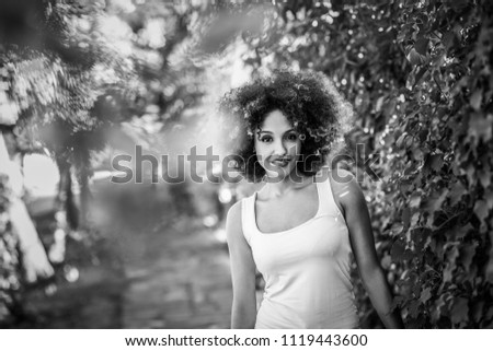 Young black woman with afro hairstyle smiling