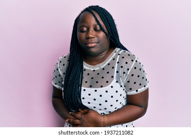 Young Black Woman With Braids Wearing Casual Clothes With Hand On Stomach Because Indigestion, Painful Illness Feeling Unwell. Ache Concept. 