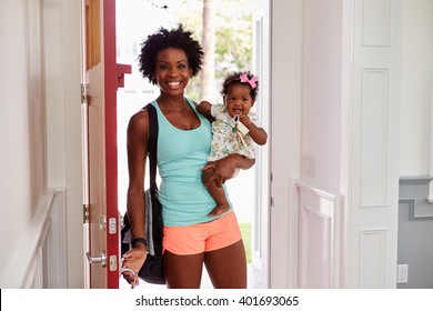 Young black woman and child arrive home after exercising