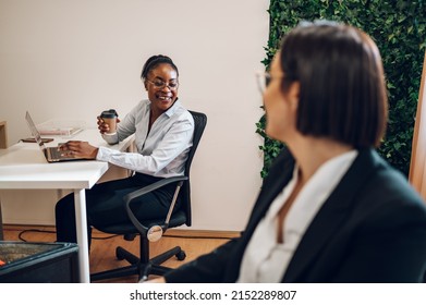 Young Black Woman Developer Working On A Laptop Computer In A Creative Office Environment. Project Manager Is Developing Data And Scheduling A Project.