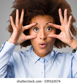 Young Black Woman Doing Open Eyes Gesture
