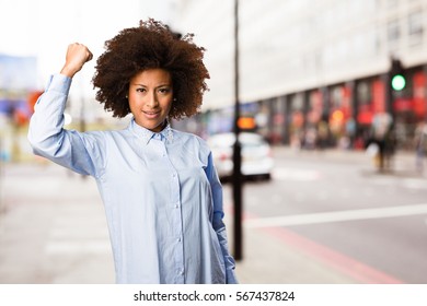 Young Black Woman Doing Strong Gesture