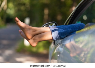 Young black woman driver taking a rest in her convertible car 