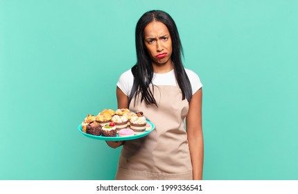 Young Black Woman Feeling Sad And Whiney With An Unhappy Look, Crying With A Negative And Frustrated Attitude. Bakery Chef Concept