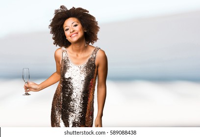 Young Black Woman Holding A Cocktail Glass