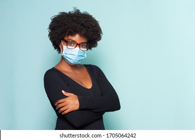 Young Black Woman With Black Power Hair Wearing Protective Mask With Reading Glasses