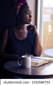  Young Black Woman Reading The Bible                              