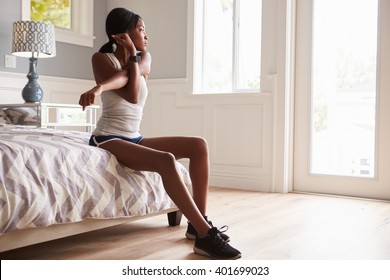 Young Black Woman Stretching At Home Before Exercising