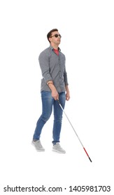 Young Blind Person With Long Cane Walking On White Background