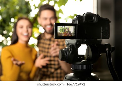 Young Bloggers Recording Video Indoors, Focus On Camera Screen