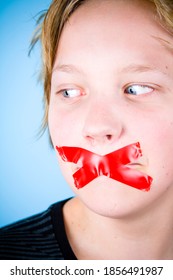 Young Blond Boy Muted, Silenced With Red Tape Over Mouth.