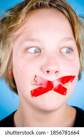 Young Blond Boy Muted, Silenced With Red Tape Over Mouth.