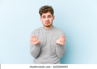 Young Blond Curly Hair Caucasian Man Isolated Showing That She Has No Money.