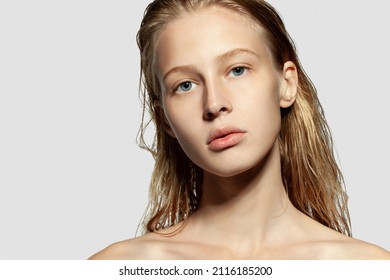 Young Blond Girl Headshot Beauty Studio Portrait On Copy Space. Model With Naked Shoulders, Wet Hair, Clean Fresh Perfect Skin Standing Looking At Camera. Cosmetology, Dermatology And Skincare