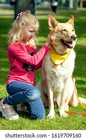 Young Blond Girl With Pet Dog At National Competition 