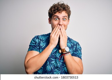 Young Blond Handsome Man On Vacation With Curly Hair Wearing Casual Summer T-shirt Laughing And Embarrassed Giggle Covering Mouth With Hands, Gossip And Scandal Concept