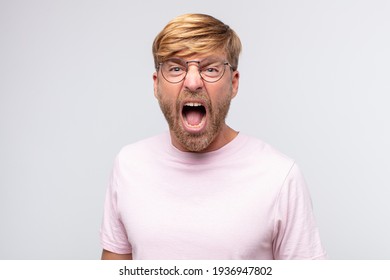 Young Blond Man Shouting And Angry