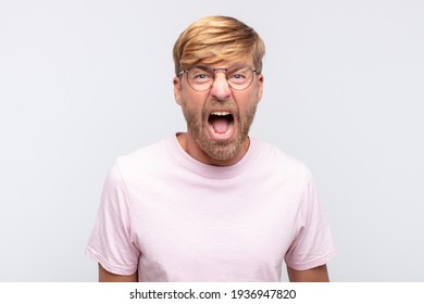 Young Blond Man Shouting And Angry