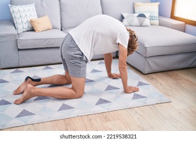 Young Blond Man Stretching Back At Home