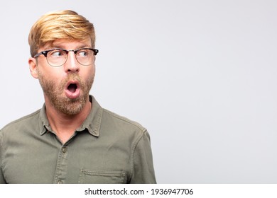 Young Blond Man Surprised Or Shocked