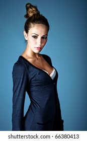 Young Blond Woman With Hair Collected In Bun, Studio Shot