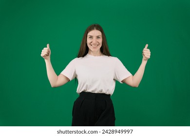 Young blond women gesturing two thumbs up smiling expression on green screen background . High quality photo - Powered by Shutterstock