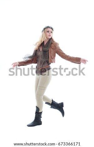 young blonde adventure  woman in a steampunk outfit, action hero pose. isolated on white background.