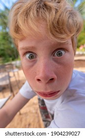 Young Blonde Boy Making A Silly Face