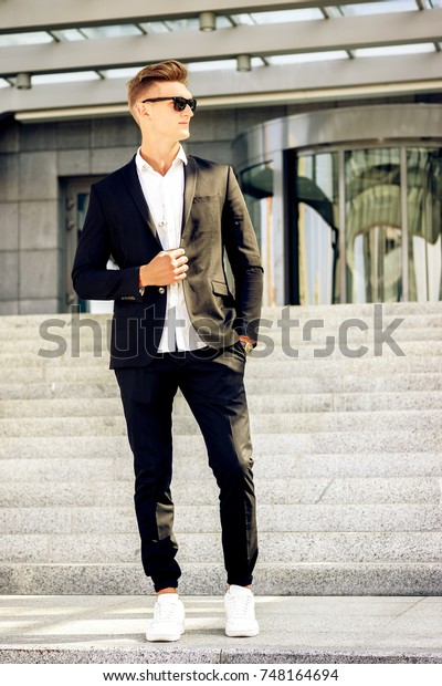 black suit with white sneakers