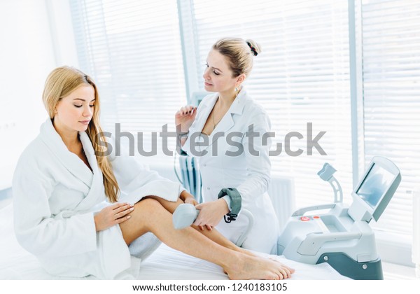 Young Blonde Female Client Chooses Laser Stock Photo Edit Now